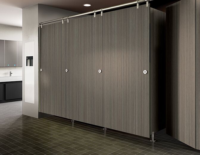 Global toilet partitions being displayed in a commercial restroom.